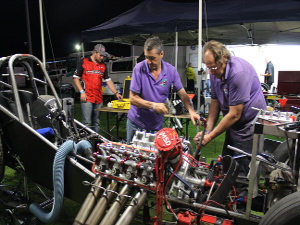 Andra officials scrutinising the engine